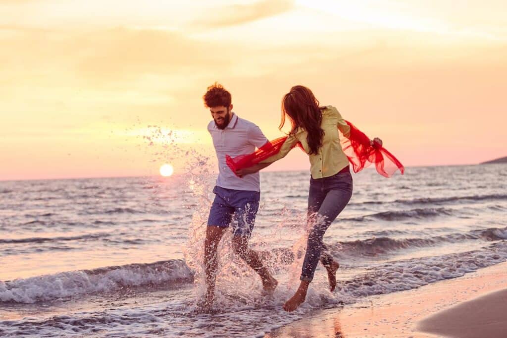 Couple Playing in the Beach Water 