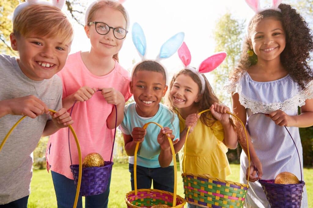 Five Children Wearing Bunny Ears On Easter Egg Hunt 