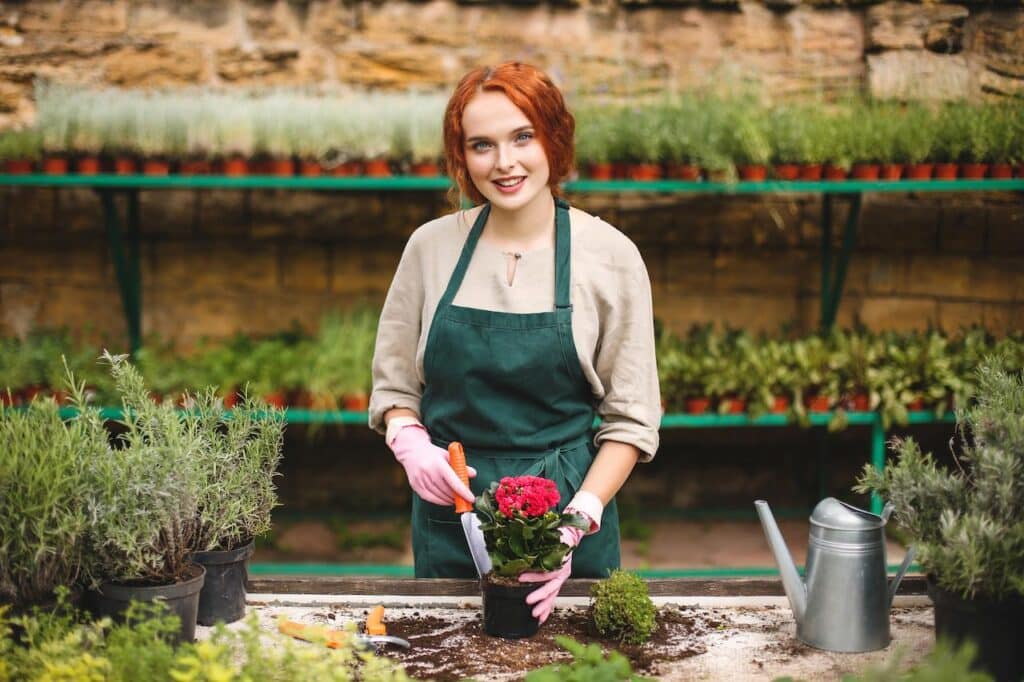 Lady Planting Flowers 