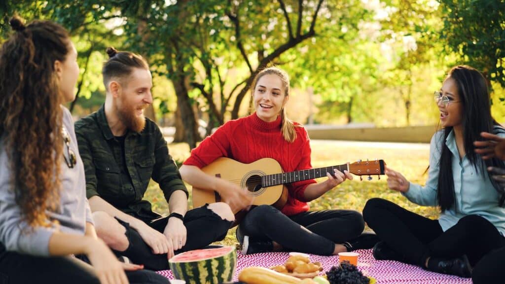 People Singing Togehter While in Picnic 